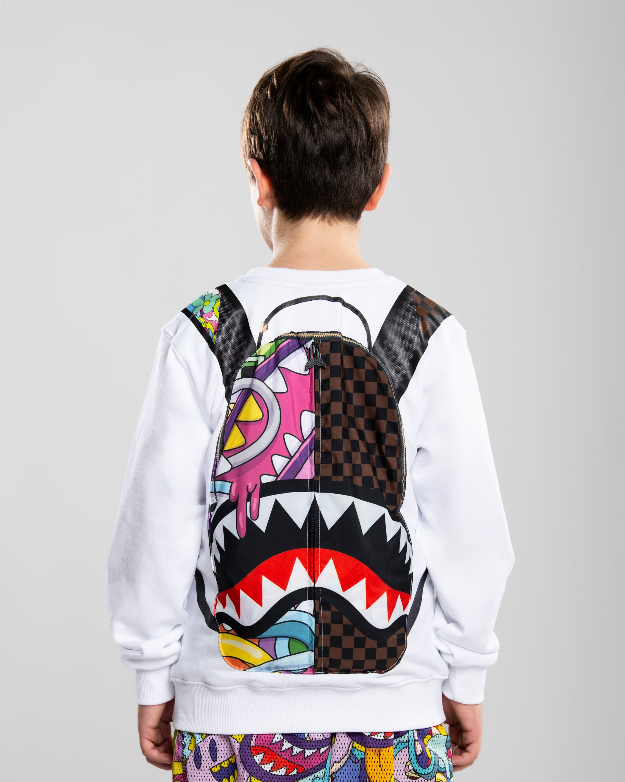 Image of Children's Jacket SPRAYGROUND LUCID DREAMS JELLY WORLD FIXES BACKPACK IN THE CREWNECK