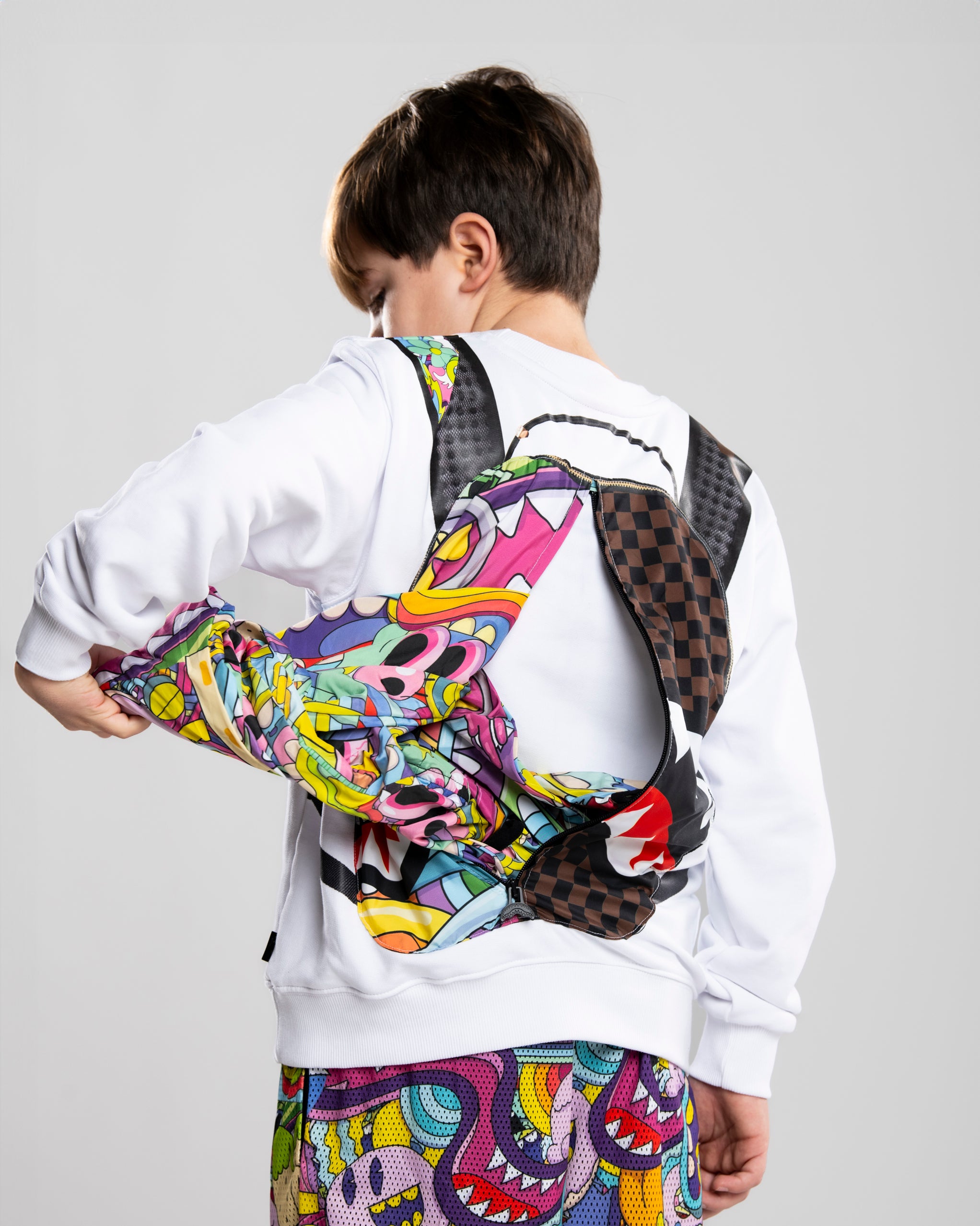 Image of Children's Jacket SPRAYGROUND LUCID DREAMS JELLY WORLD FIXES BACKPACK IN THE CREWNECK