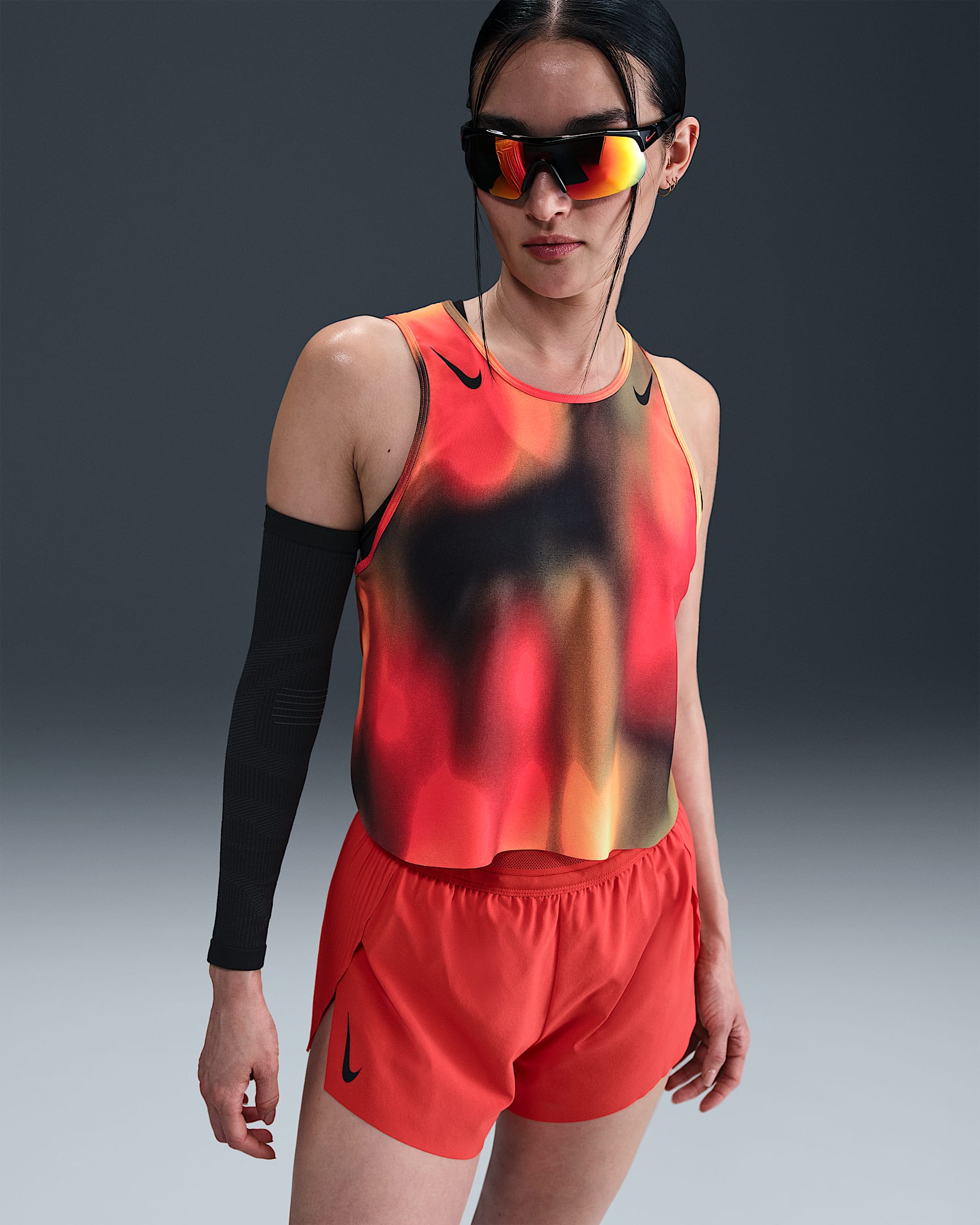 Image of Дамски Потник NIKE W NK DFADV ARSWT AOP CRP TANK, Балистик,оранжев цвят